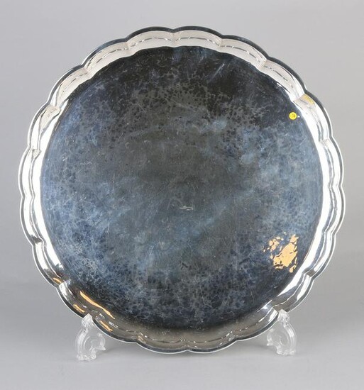 Large round silver tray, 835/000, with a raised