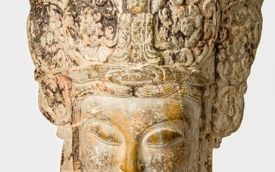 MONUMENTAL CHINESE STONE HEAD OF A GUANYIN (AVALOKITESVARA) WITH LUSH VEGETABLE HEADDRESS