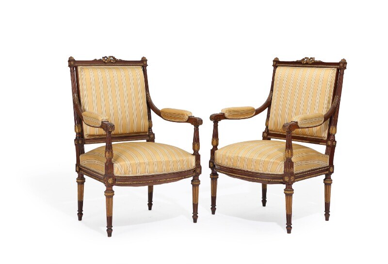 NOT SOLD. A pair of French circa 1900 partly gilt mahogany Louis XVI style "fauteuil...