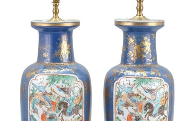 PAIR OF CHINESE POLYCHROME PORCELAIN VASES In rouleau form, with two famille verte cartouches depicting warriors on horseback. Powde...