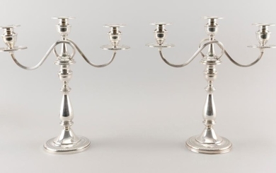 PAIR OF MUECK-CAREY CO. GEORGIAN-STYLE WEIGHTED STERLING SILVER CONVERTIBLE THREE-LIGHT CANDELABRA Not monogrammed. Heights 13".