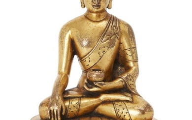 Property of a Gentleman (Lots 55-80) A Chinese gilt bronze Zanabazar school figure of Shakyamuni Buddha, 18th century, seated in dhyanasana on a double lotus base, clutching a bowl in his lap, incised with double vajra to base plate, 15cm high 十八世紀...