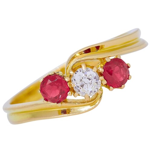 RUBY AND DIAMOND 3-STONE TWIST RING, in 18 ct. gold. Set wit...