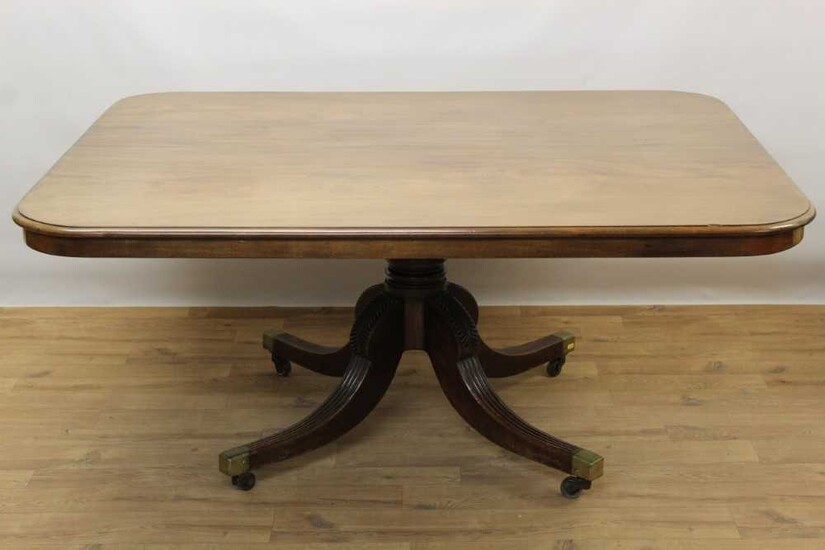 Regency mahogany breakfast table with rectangular tilt top on pedestal base with four splayed legs