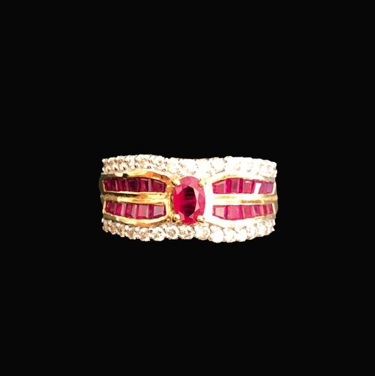 Ring in 18K (750°/°°) yellow gold set with rubies and paved with lines of small diamonds.