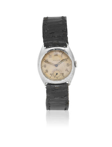 Rolex. A mid-size stainless steel manual wind tonneau form wristwatch