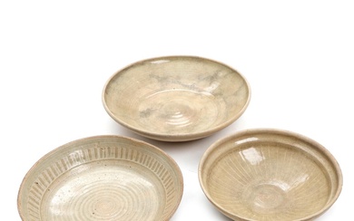 Three Asian pottery bowls, decorated in greenish glaze with slip decor. 17th-18th...