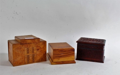 Three cigarette despencers, one art deco example made of birds eye maple, Indian carved hardwood