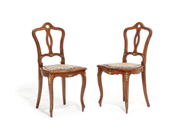 Two Austrian walnut Rococo style chairs, adorned with bronze mountings. Circa 1900. (2)