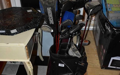 Two golfing bags containing various golf clubs including Benross Xtreme...