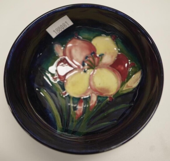 William Moorcroft blossom decorated bowl decorated on dark blue...