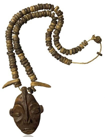 Wooden necklace with an amulet. Zaire, the twentieth