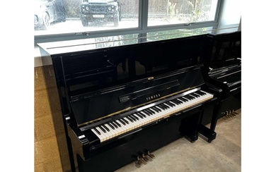 Yamaha (c1974) A Model U2 upright piano in a bright ebonised...