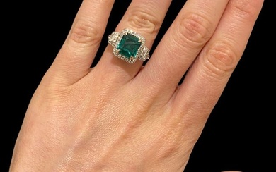 18kt WG Stunning 3.47 CT GIA Certified Green Emerald Ring with Over 2ct VS-E diamonds.