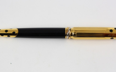 Must de Cartier Panthere roller ball pen, having a yellow gold plated body accented with black lacquer in the "Panthere" motif, the ...