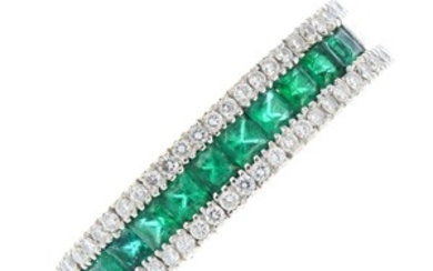 An 18ct gold emerald and diamond flexible ring. View more details