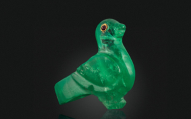 AN ANTIQUE CARVED EMERALD AND RUBY BIRD