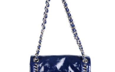 CHANEL - a small Luxe Ligne Flap handbag.