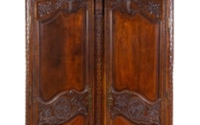 A French Provincial Carved Walnut Armoire