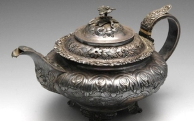 A George IV silver teapot, the compressed circular form