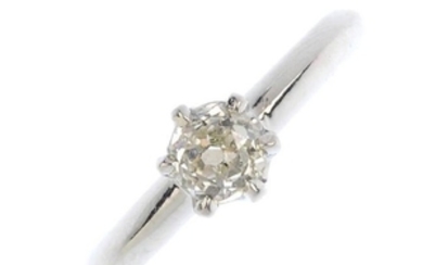 A platinum diamond single-stone ring. The old-cut