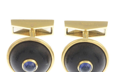 A pair of sapphire cabochon and brown coral cufflinks, by Boucheron.