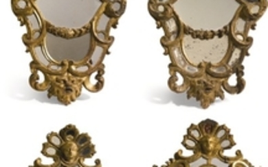 A set of four Italian late baroque carved giltwood mirrors, probably Rome, circa 1730
