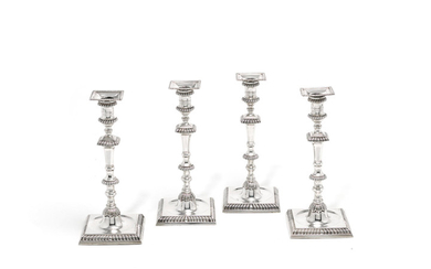 A set of four George III silver candlesticks
