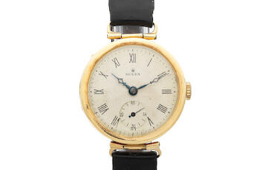 Rolex. An 18K gold manual wind wristwatch