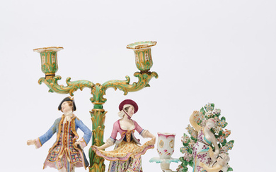 AN ENGLISH PORCELAIN FIGURAL BOCAGE CANDLESTICK TOGETHER WITH A PORCELAIN TWIN BRANCH CANDLESTICK