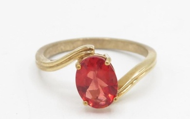 9ct gold oval cut orange gemstone dress ring in a four claw ...