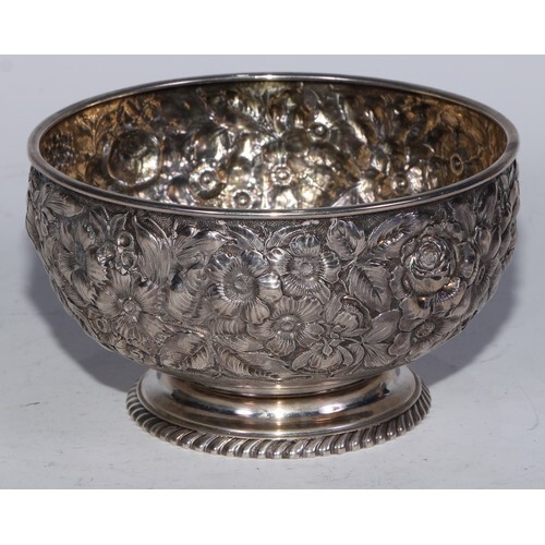 A 19th century American silver circular pedestal bowl, profu...