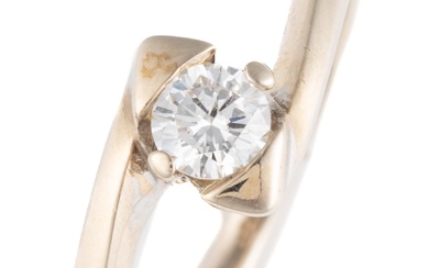 A 9CT GOLD SOLITAIRE DIAMOND RING; set with a round brilliant cut diamond of approx. 0.19ct between bypass shoulders, width 6.4mm, s...