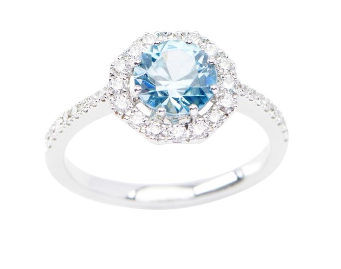 A BLUE ZIRCON AND DIAMOND RING