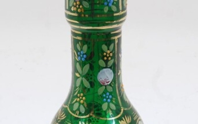A Bohemian green glass bottle vase, 19th century, the thickly blown rim with gilt highlights, the neck and body with gilded panels containing enamelled floral sprays, with further circular panels of floral sprays to the lower body, atop a spreading...