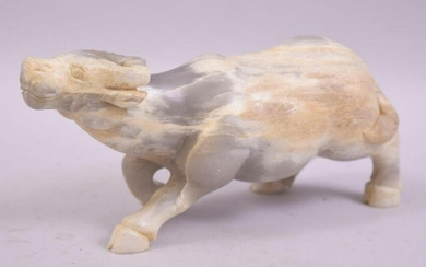 A CHINESE HARDSTONE OR WHITE JADE CARVING OF A BUFFALO