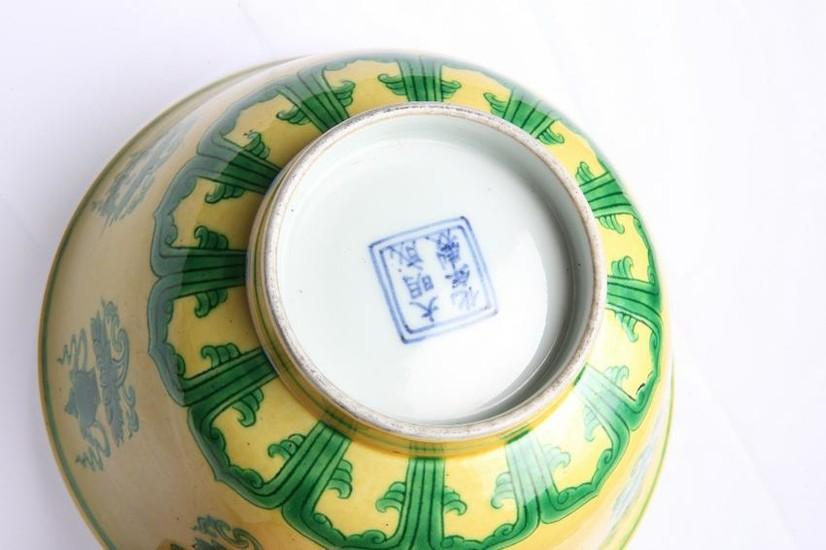A CHINESE YELLOW GROUND AND GREEN DECORATED BOWL