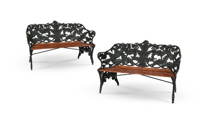 A CLOSE PAIR OF CAST IRON GARDEN BENCHES IN THE FERN AND BLACKBERRY PATTERN, ONE BY J.C.G. BOLINDER