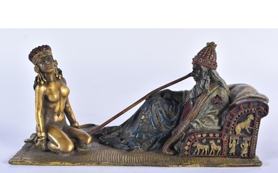 A COLD PAINTED BRONZE FIGURE OF A SEATED MALE beside a nude ...