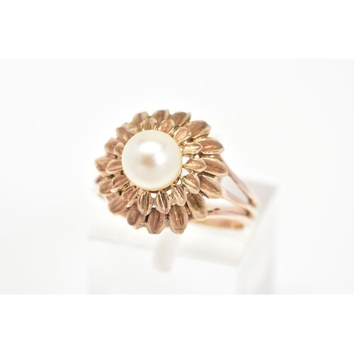 A CULTURED PEARL RING, of a tiered floral design set with a ...