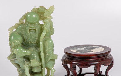A Chinese Carved Celadon Jade Figural Group
