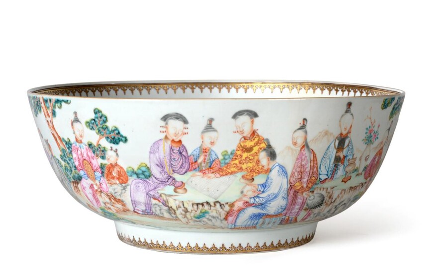 A Chinese Porcelain Punch Bowl, Qianlong, painted in famille rose enamels with figures at...