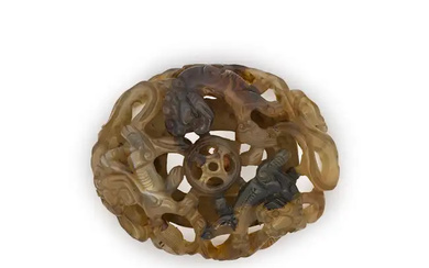 A Chinese archaistic reticulated agate ‘Buddhist lion dog’ plaque Ming/Qing dynasty, 17th...