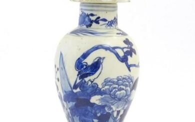 A Chinese blue and white vase and cover with floral