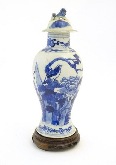 A Chinese blue and white vase and cover with floral