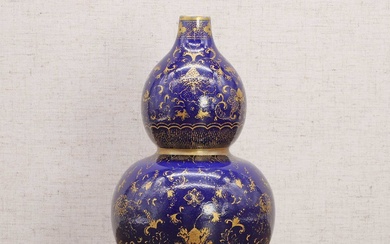 A Chinese blue-glazed double gourd vase