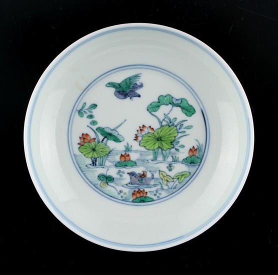 A Chinese doucai saucer dish painted with a pond...
