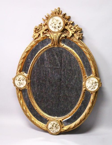 A DECORATIVE, LARGE OVAL FRENCH STYLE GILT FRAMED