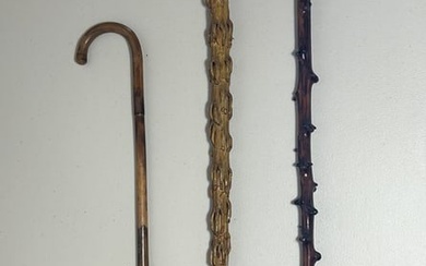 A GROUP OF THREE VINTAGE WOODEN WALKING STICK