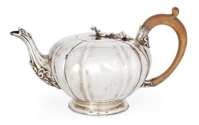 A George IV silver teapot, London, 1821, Sebastian Crespel II, of circular, fluted form with wooden handle and flower finial to hinged lid, the spout with acanthus tip, 14.2cm high (inc. handle), approx. weight 20.8oz